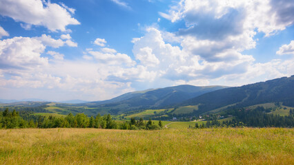 nature scenery with hills and meadows. rural valley in the distance. sunny forenoon in summertime....