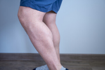 Male calf of the leg, side view. Athletic men's legs.