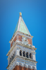 Part of the bell tower of St. Mark against the blue sky