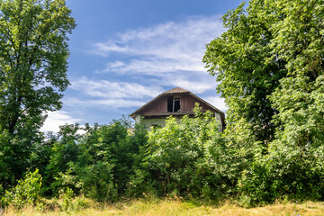 Fototapeta na wymiar Beautiful old abandoned building farm house in countryside on natural background