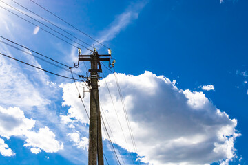 Power electric pole with line wire on colored background close up