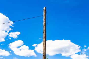 Power electric pole with line wire on colored background close up