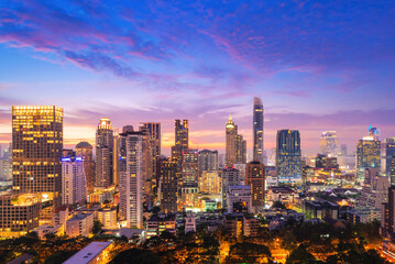 Fototapeta na wymiar Aerial twilight cityscape view of Bangkok modern central area in Bangkok at Thailand