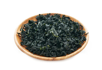 dried Laminaria Kelp Seaweed on wood bowl isolated on white Background. dried Laminaria or kelp Seaweed on bowl Background. konbu, alga, wakame