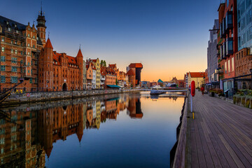 Reflection of old town in Motlawa river at sunrise