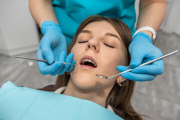 Fototapeta premium top view of a girl patient who came to check her teeth at the dentist.