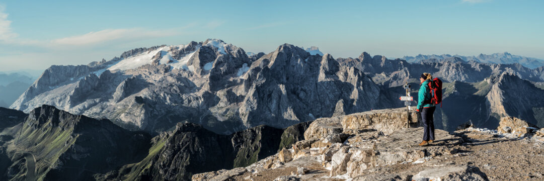 Woman looking at mountains on sunny day at Dolomites, Italy