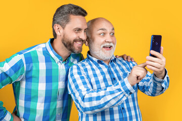 cheerful men make family blog in studio. men make family blog on background.