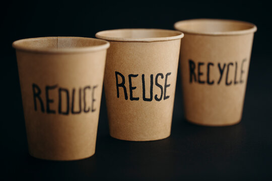 Reusable cups arranged against black background