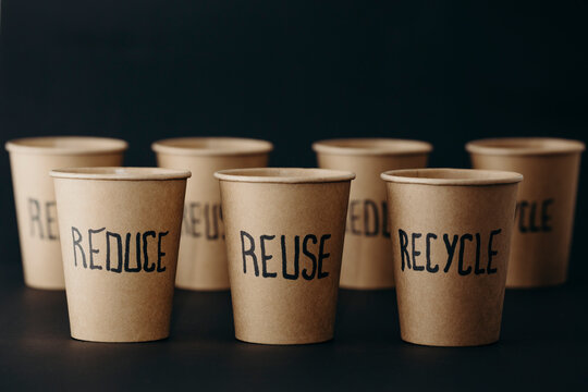 Reusable cups arranged against black background