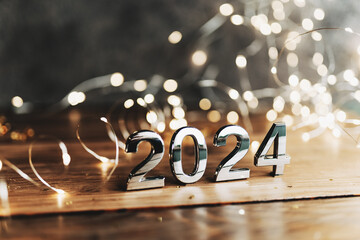 happy new year 2024 background new year holidays card with bright lights,gifts and bottle of...