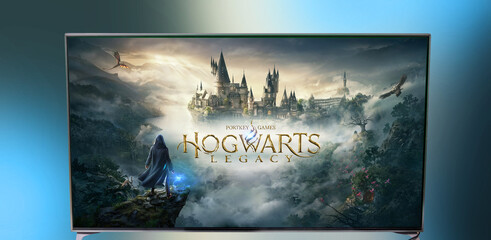 Naklejka premium Minsk, Belarus - February 19, 2023: game Hogwarts Legacy on a big TV. Play computer games