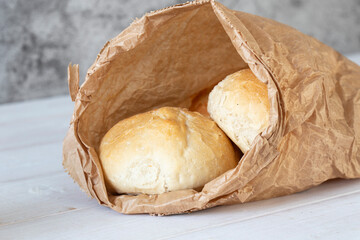 Bread roll buns in a brown paper bag. Eco friendly recycle disposable sustainable packaging