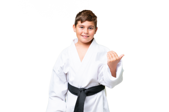 Little caucasian kid doing karate over isolated chroma key background inviting to come with hand. Happy that you came