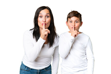 Little caucasian kid over isolated chroma key background showing a sign of closing mouth and silence gesture