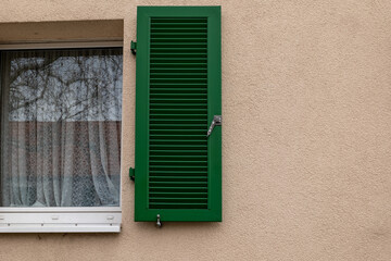 a window with green shutters
