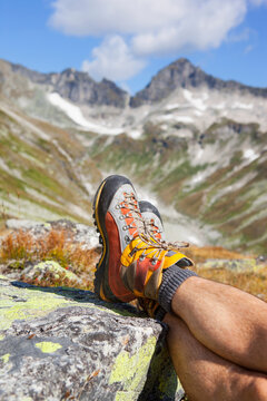 A male hiker takes a rest during the Glocknerrunde, a 7 stage trekking from Kaprun to Kals around the Grossglockner, the highest mountain of Austria.