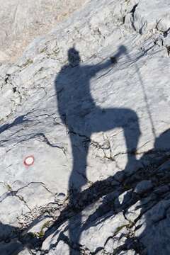 Shadow of hiker at summit of Triglav, Slovenia
