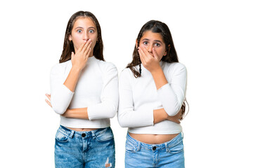 Friends girls holding gift and a birthday cake over isolated chroma key background covering mouth with hands for saying something inappropriate - obrazy, fototapety, plakaty