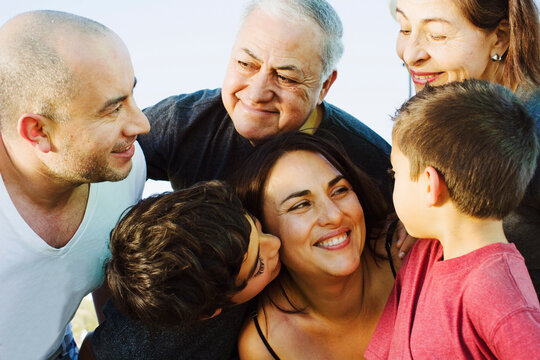 A hispanic family enjoys time together at a park in San Diego, Ca.