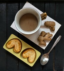 Cup of coffee and biscuit on the table 