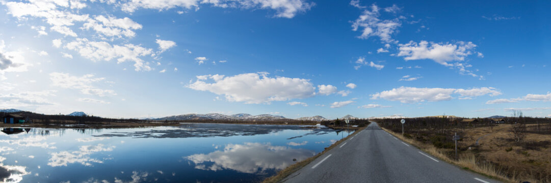 Panorama of country road along pond, Ringebu, Oppland, Norway