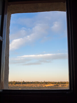 Cloudy sky through window, Erfoud, Morocco.