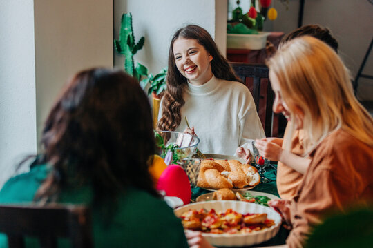 Happy family having Easter dinner together at home