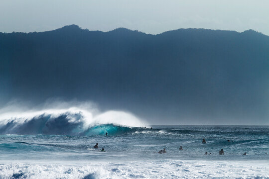 A surfer in the tube at pipeline.