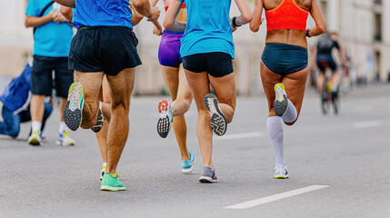 back five runners men and women running city marathon race