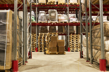 Fototapeta na wymiar Wide angle view at storage warehouse interior with stack of boxes, copy space