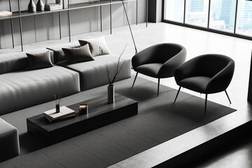 Top view of grey chill interior with couch, armchairs and panoramic window