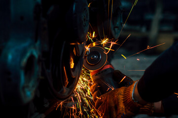 long exposure photo car repair, installation of rear disc brakes instead of drums, welding,...