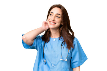 Young nurse woman over isolated chroma key background thinking an idea