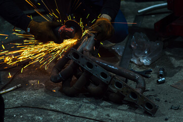 long exposure photo car repair, installation of rear disc brakes instead of drums, welding,...