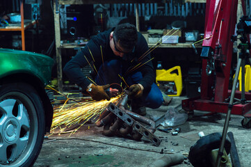 long exposure photo car repair, installation of rear disc brakes instead of drums, welding,...