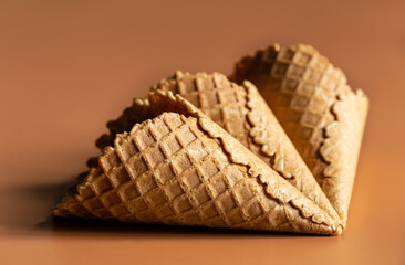 Close-up of waffle cones, creative macro concept of sweets and food.