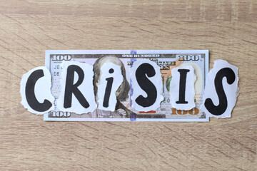 Fototapeta premium Crisis lettering on dollar banknote. Financial crisis concept. 