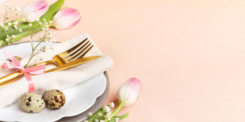 Festive Easter table decoration idea in peach-pink colors. Holiday banner. Copy space. Mock up.