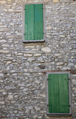 Fototapeta na wymiar Italian window in an old stone house