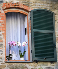 Italian window in an old stone house