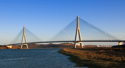 Fototapeta na wymiar international bridge in the Guadiana river between spain and portugal