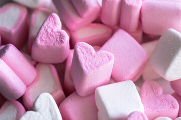 Pink and white marshmallows in the form of hearts, close-up.