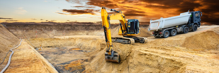 excavator is working and digging at construction site