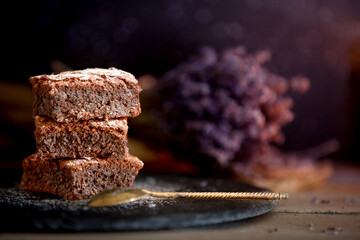 Dark chocolate brownies stack, lavender flowers