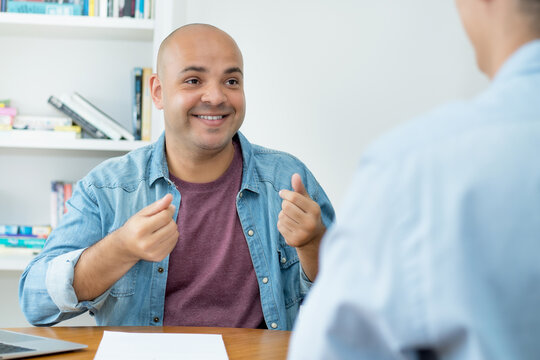 Motivated IT specialist at job interview with businessman