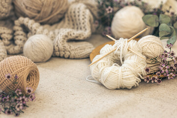 Cozy home composition with threads for knitting.