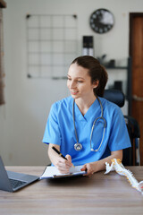 Portrait of a female doctor Center of Excellence from Orthopedic Center are using computers and...