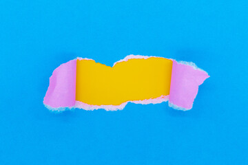 Colored paper torn in the middle, copy space