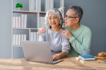 Fototapeta premium Elderly couple asian people grandfather and grandmother living together in retirement Concept of elderly health and health insurance.